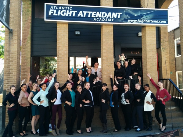 Exterior shot of the Atlantic Flight Attendan Academy with students in front